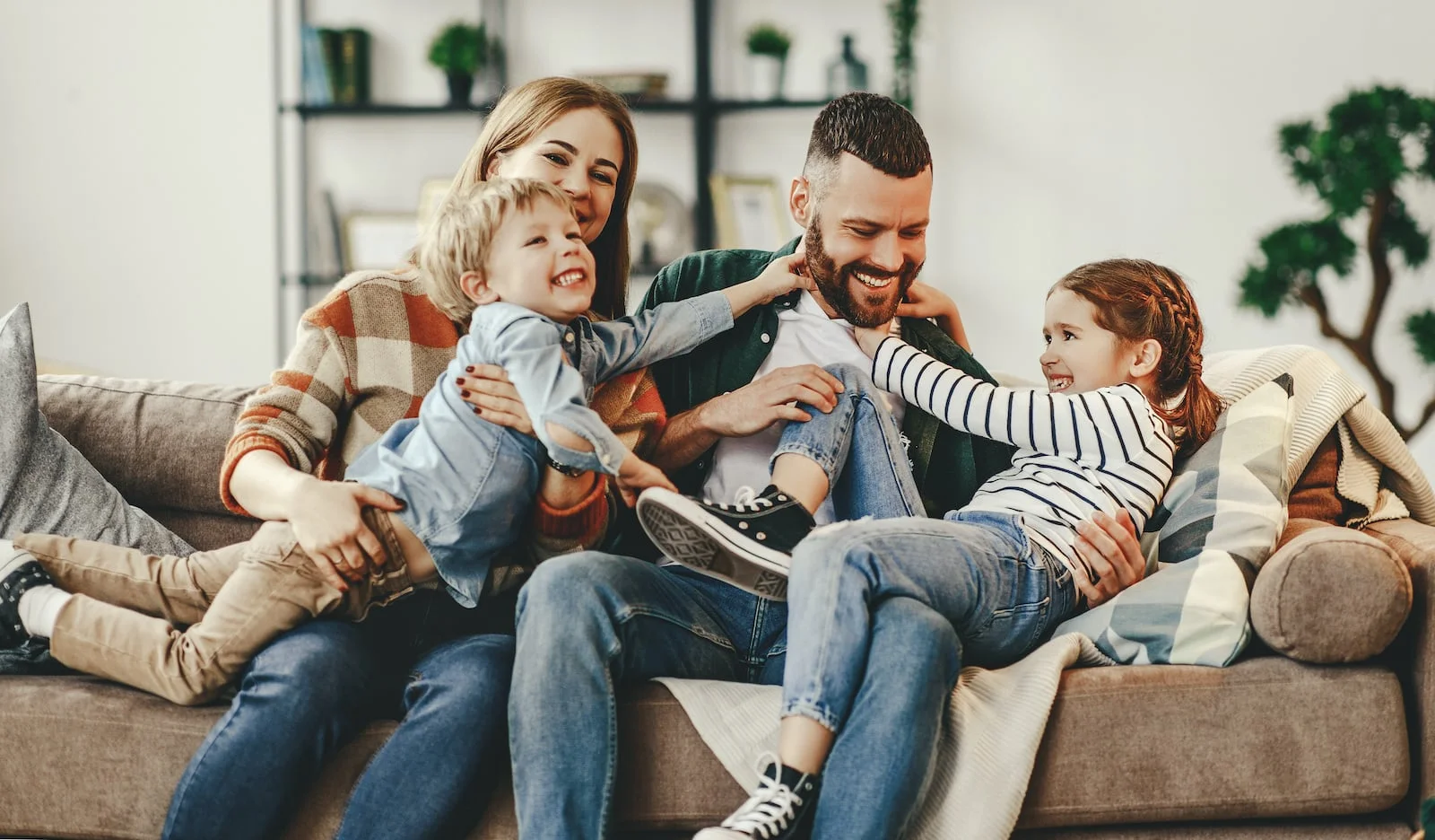 happy family on couch smiling